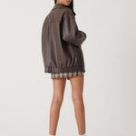 Florence brown leather jacket, model side view with stand collar and zip front