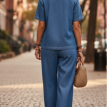 Blue denim two-piece set, back view of buttoned top with wide-leg pants