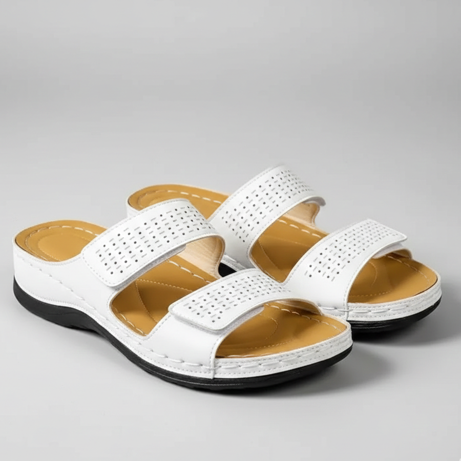 White orthopedic sandals with perforated triple straps and black cushioned sole