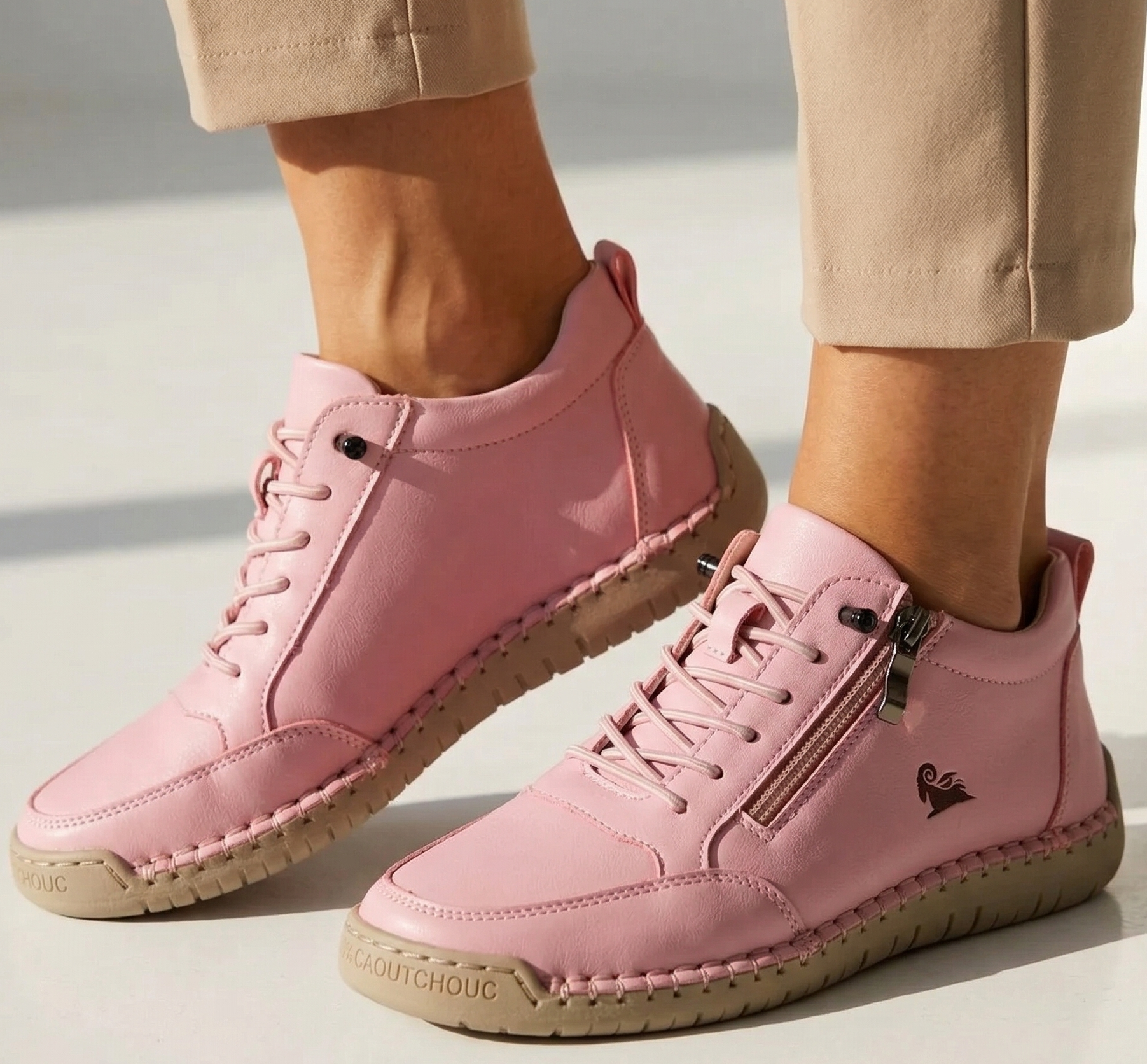 Pink sport orthopedic sneakers with lace-up front, side zipper, and cushioned outsole.