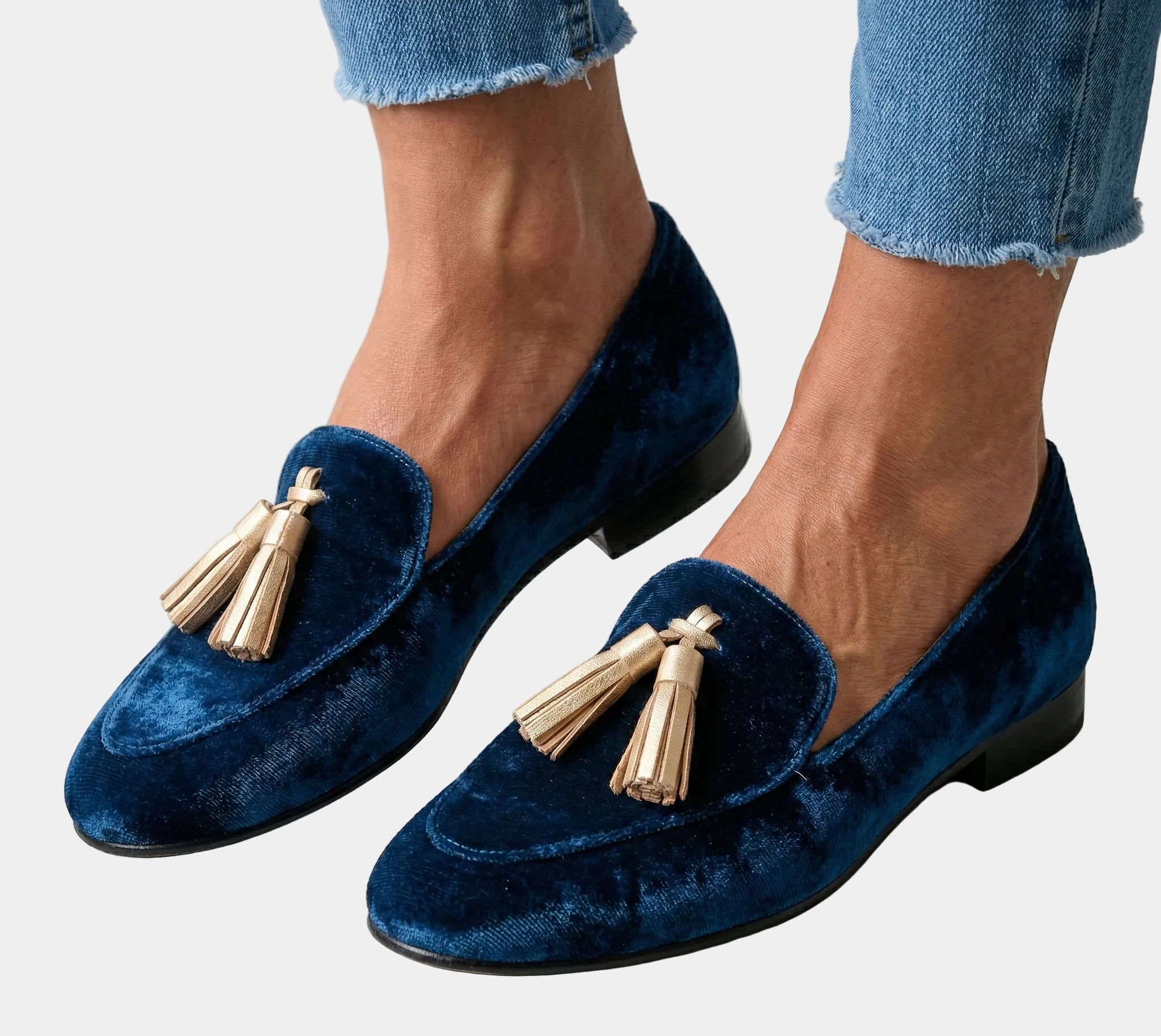 Classic dark blue velvet loafers with gold tassel fringe and low heel