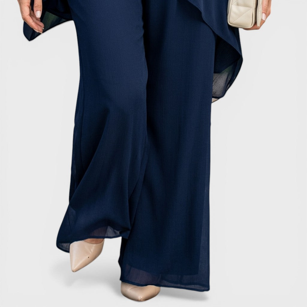 Navy chiffon wide-leg pants with sheer overlay at the hem