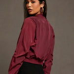 Burgundy satin bomber jacket back view with elastic cuffs