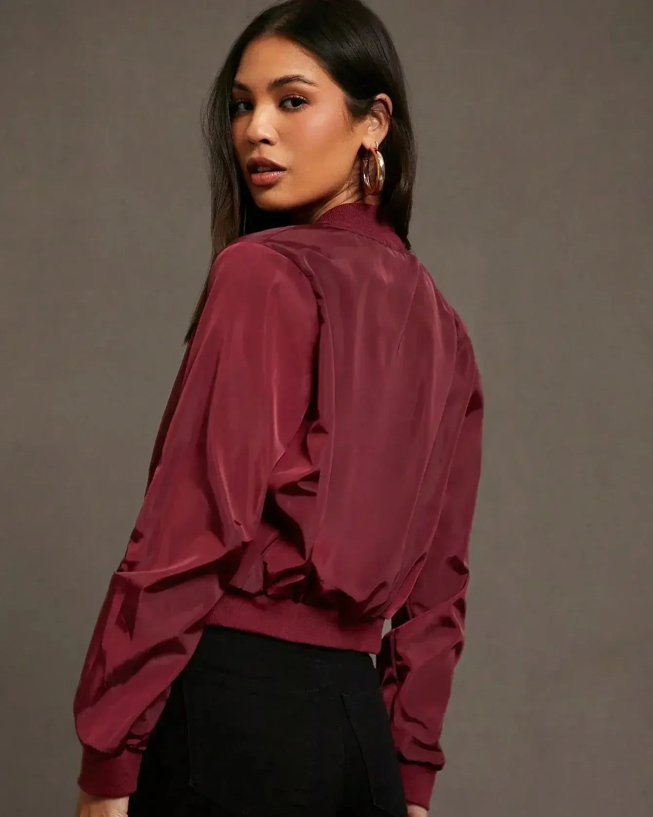 Burgundy satin bomber jacket back view with elastic cuffs