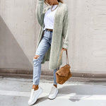 Long light green knit cardigan with open front, textured fabric, ribbed cuffs and hem.