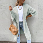 Long light green knit cardigan with open front, ribbed cuffs and textured knit hem.
