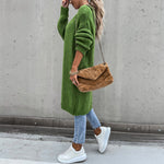 Long green knit cardigan with open front and side pockets, relaxed fit