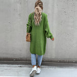 Long green knit cardigan with open front and side pockets, back view
