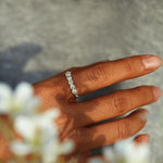 Silver daisy ring with repeating flower links and gold center beads