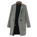 Black-and-white herringbone overcoat with notch lapels and two-button front