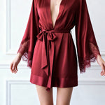 Red satin short robe with deep V neckline, waist tie, and lace sleeve cuffs