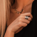 Wide silver stack ring with ribbed bands and smooth polished edges