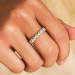 Silver floral band ring with tiny daisy motifs and gold center accents