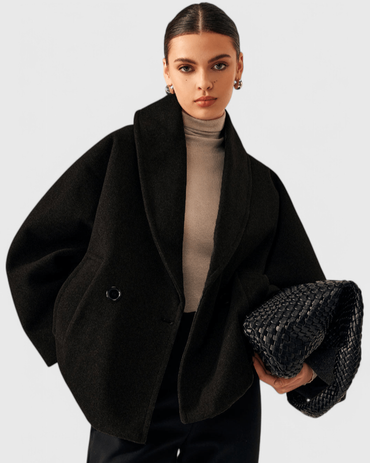 Black tweed-look coat with wide lapels and front buttons, side flap pockets