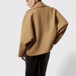 Beige tweed-look coat, back view, wide collar and loose relaxed fit