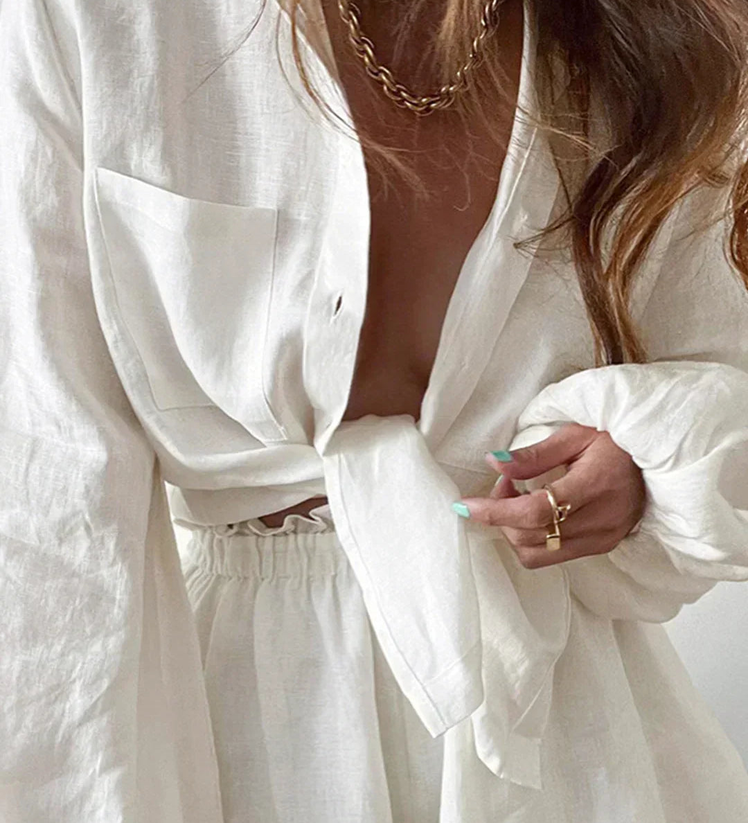 Lined two-piece shorts set, white wrap-style top and elastic waist shorts