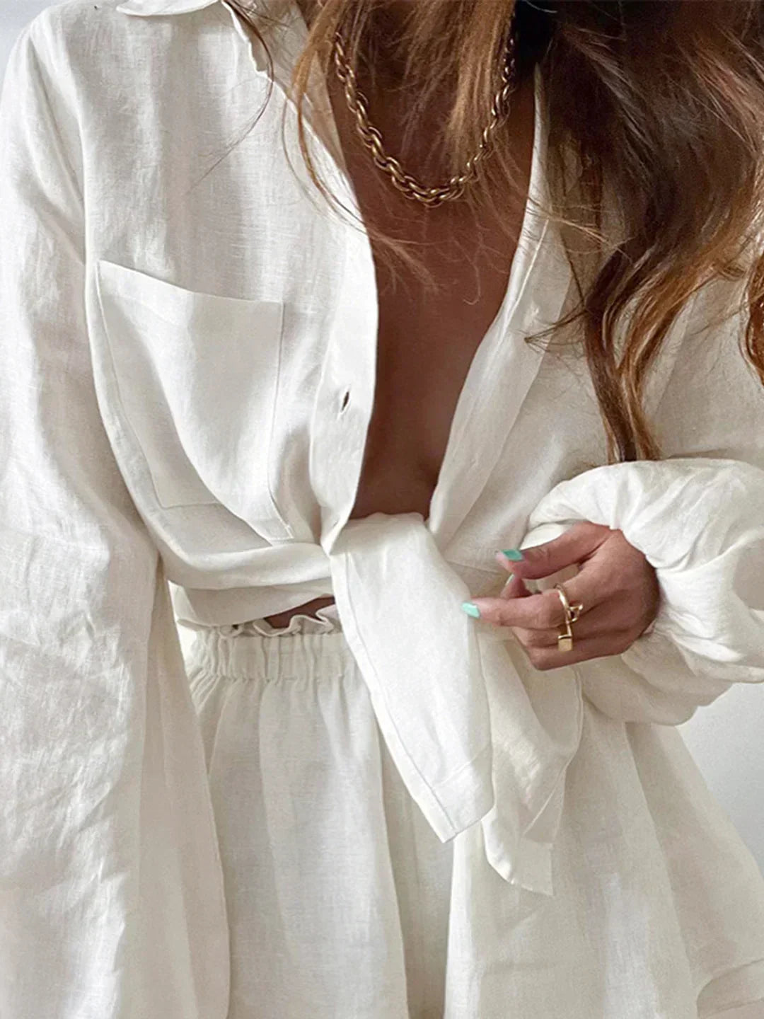 Lined two-piece shorts set, white wrap-style top and elastic waist shorts