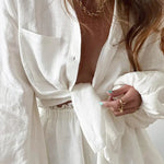 Lined two-piece shorts set, white wrap-style top and elastic waist shorts