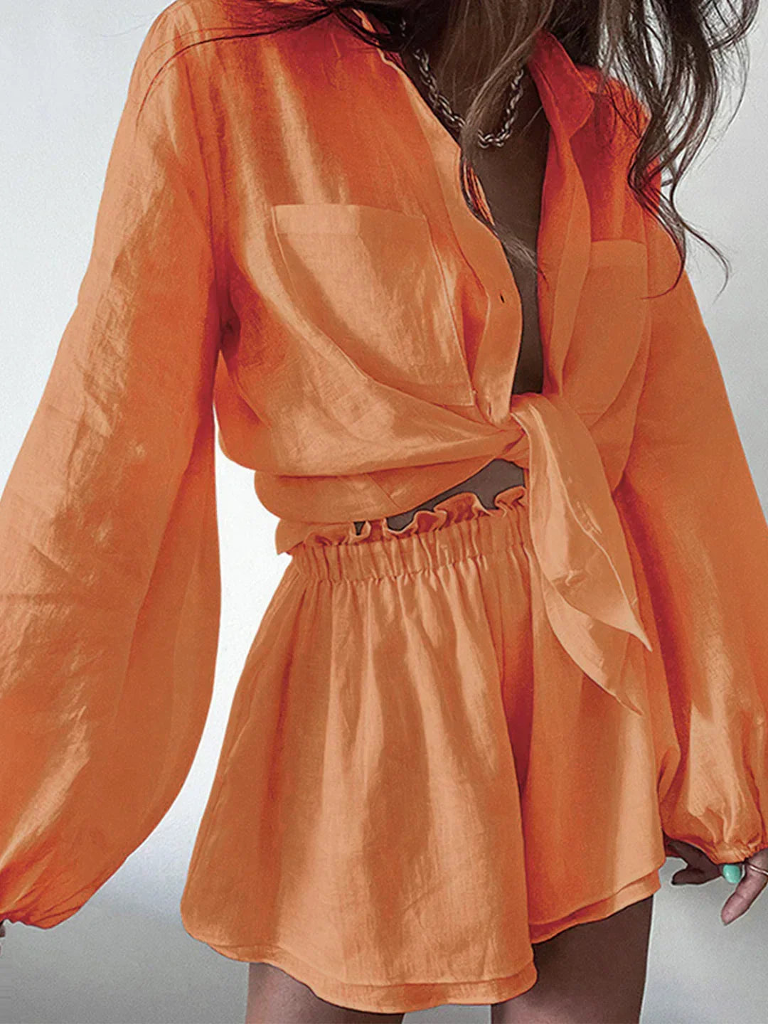 Lined two-piece shorts set, orange long-sleeve top and elastic waist shorts