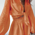 Lined two-piece shorts set, orange long-sleeve top and elastic waist shorts