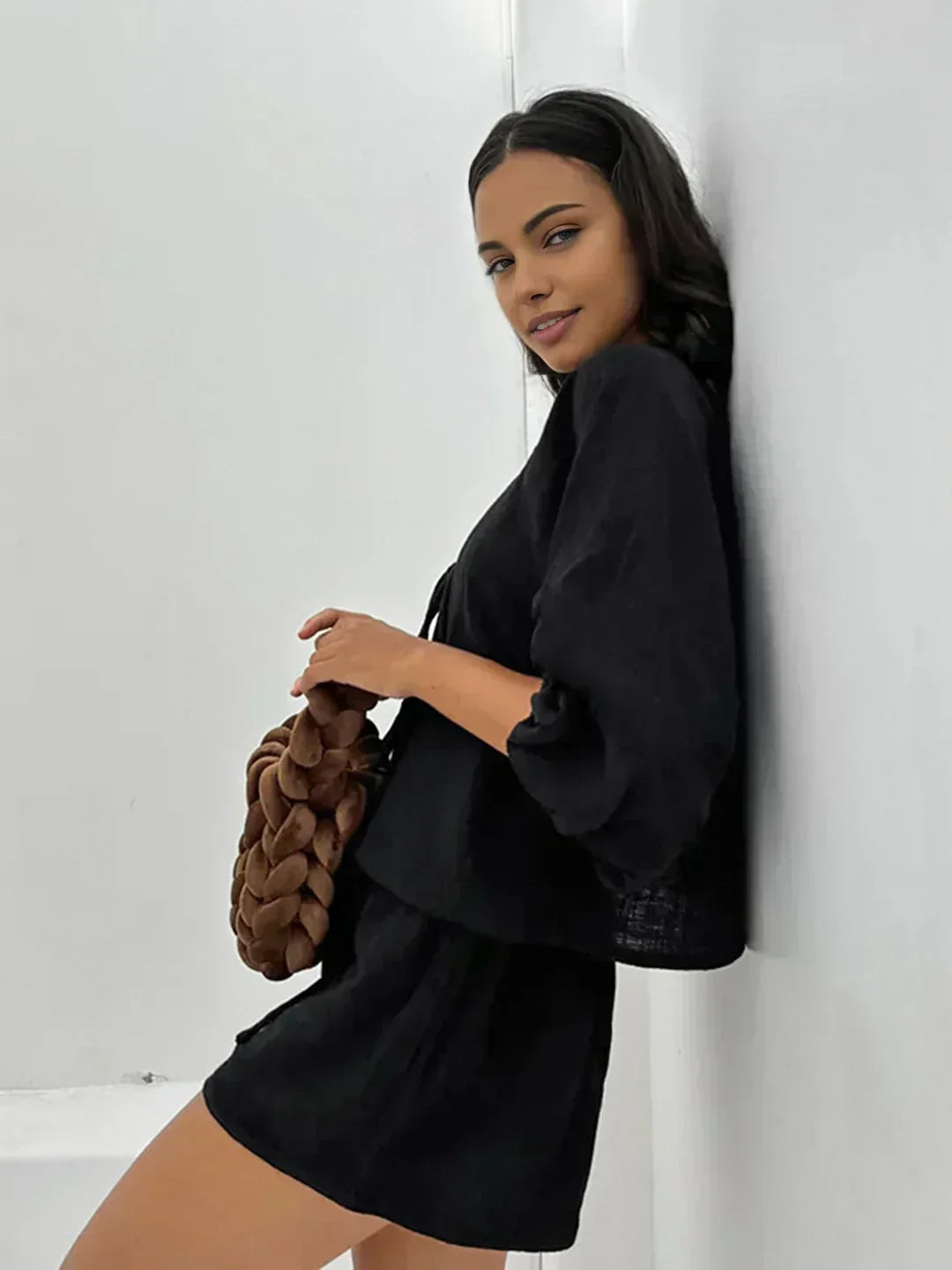 Black short set with long flared sleeves and bow-tie neckline detail