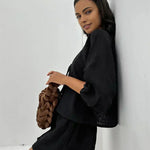 Black short set with long flared sleeves and bow-tie neckline detail