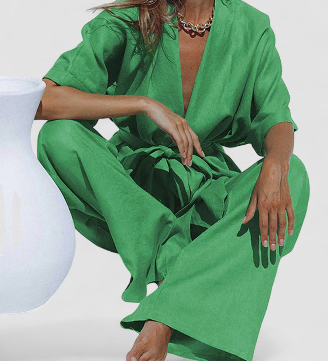 Green oversized pants set with V-neck tunic and wide-leg trousers, tied waist