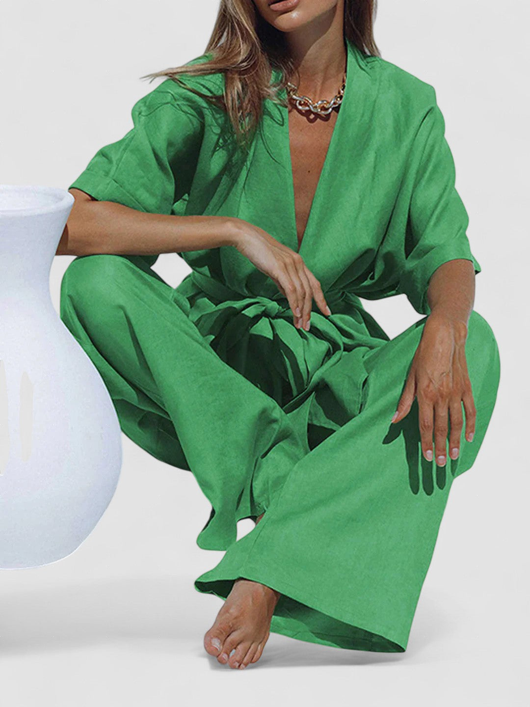 Green oversized pants set with V-neck tunic and wide-leg trousers, tied waist