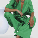 Green oversized pants set with V-neck tunic and wide-leg trousers, tied waist