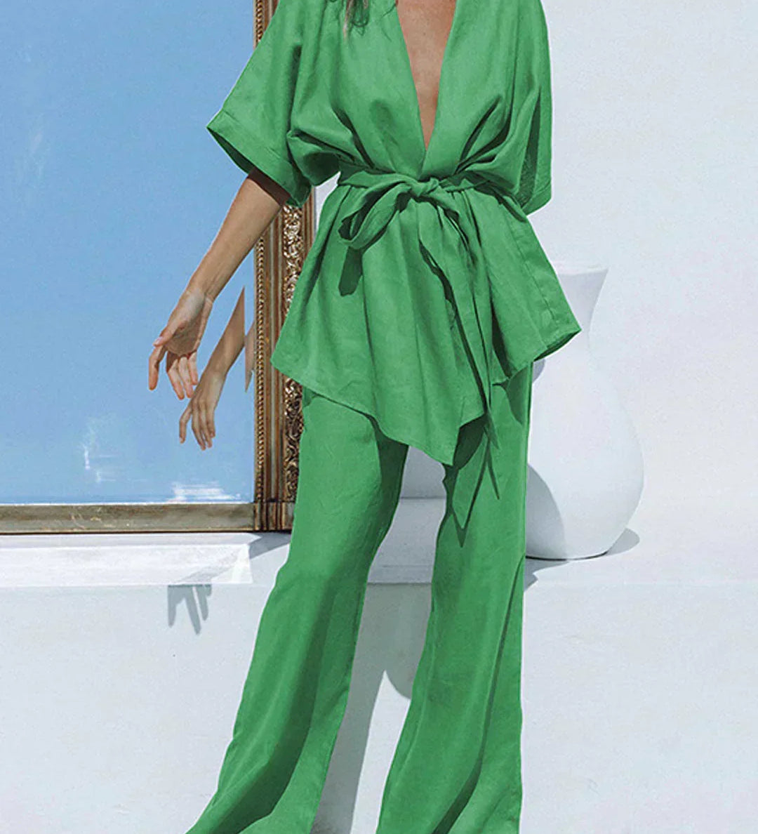Green wide-leg trousers with tied waist and matching V-neck tunic, oversized fit