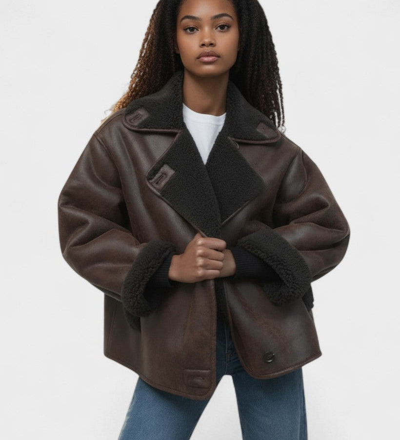 Women’s dark faux leather jacket with shearling-trim collar and flap pockets