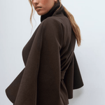 Dark brown belted jacket with high collar and button front, cape sleeves