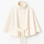 Cream short cape jacket with button front and tied waist belt
