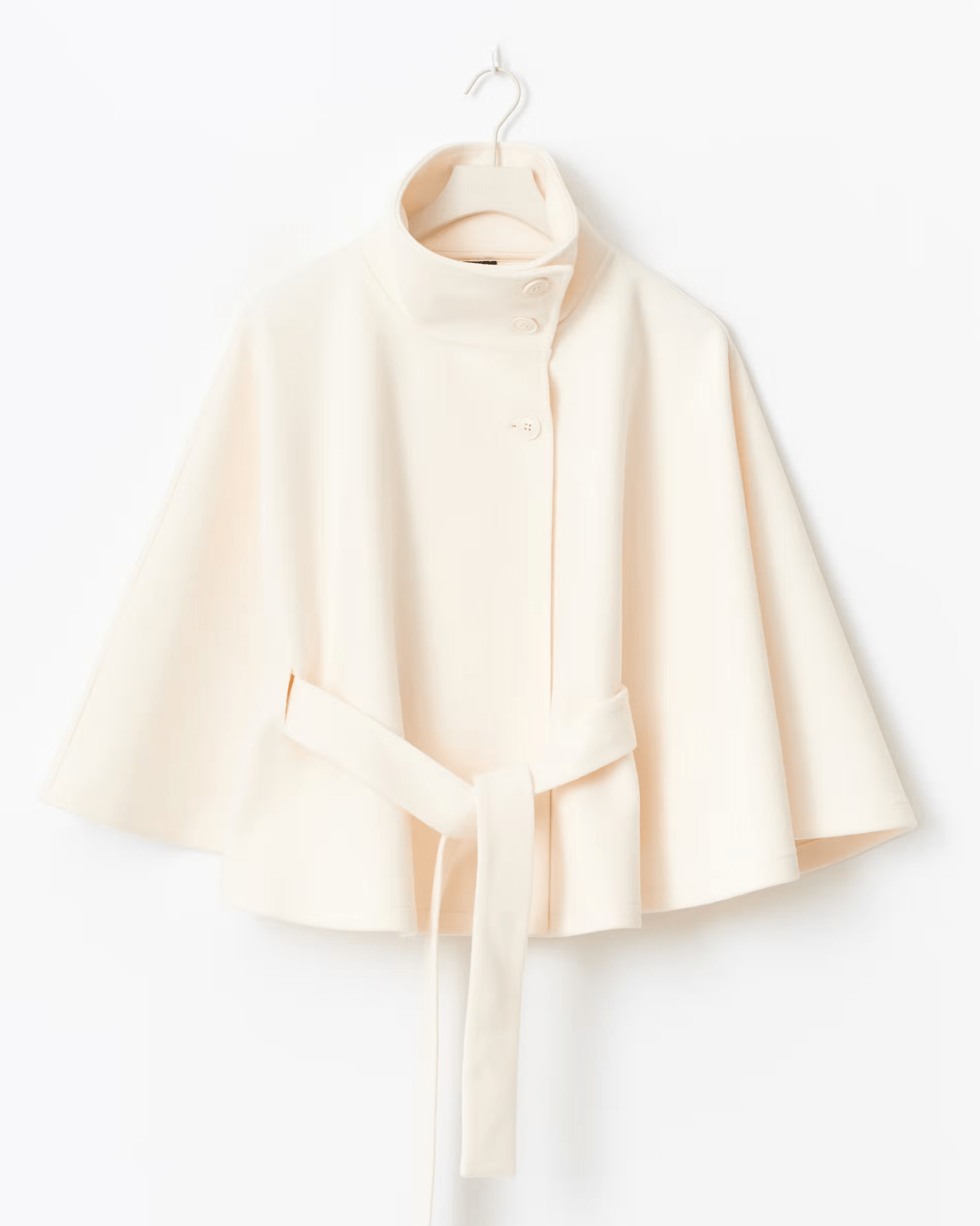 Cream short cape jacket with button front and tied waist belt