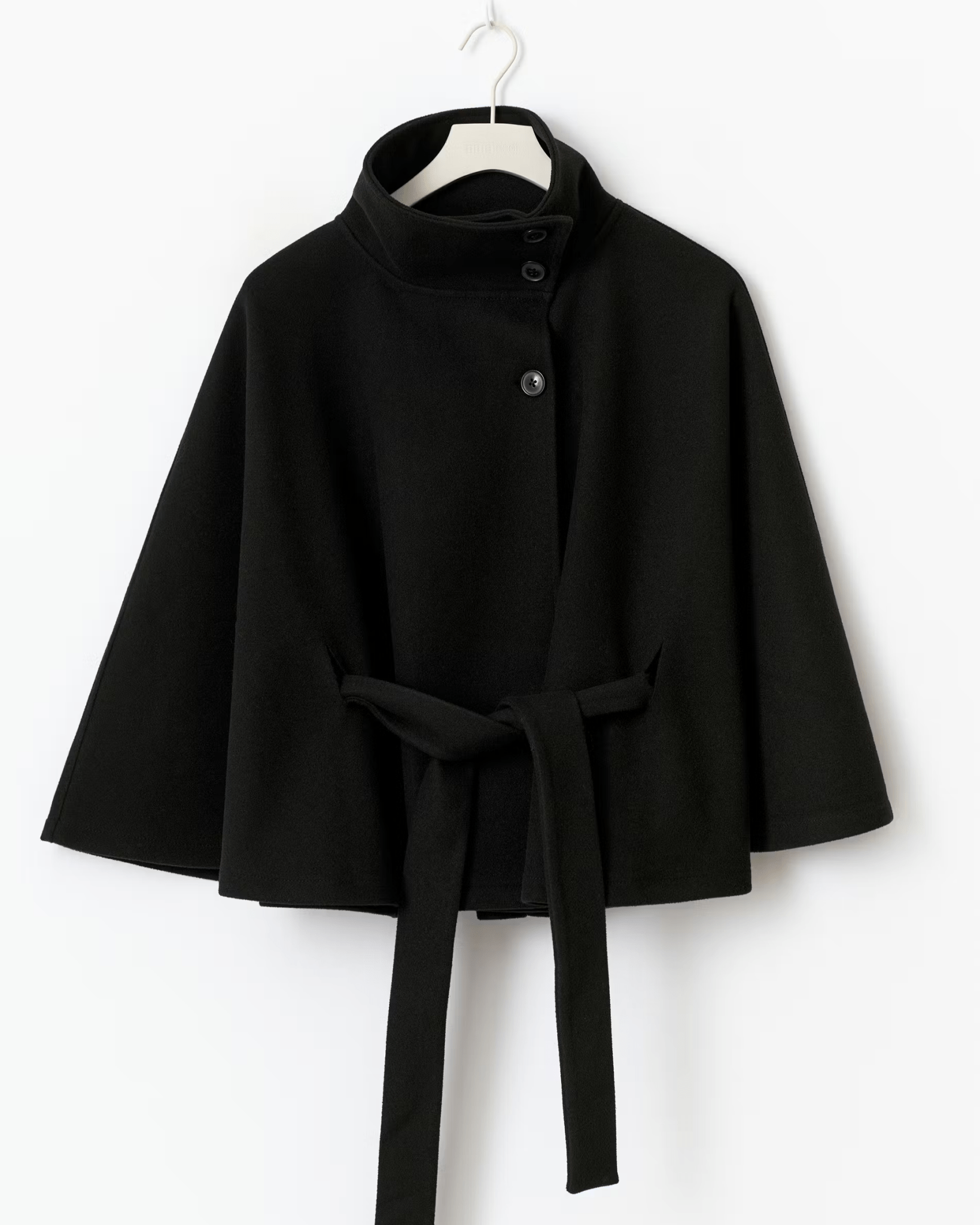 Black short cape jacket with button front and waist tie belt