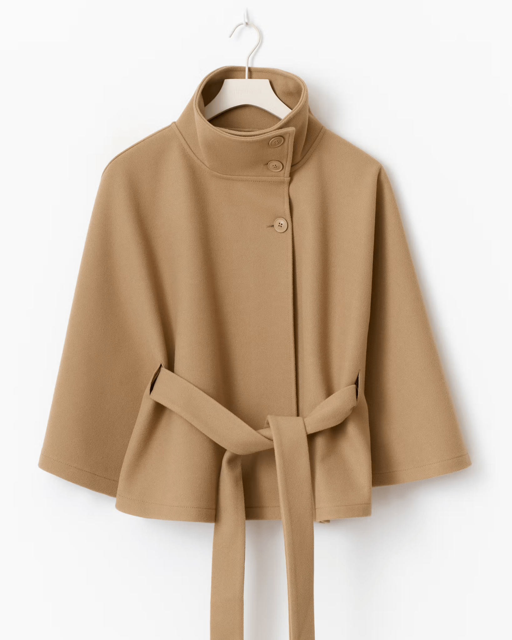Tan short cape jacket with button front and waist tie belt