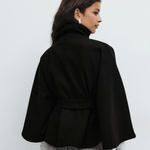 Black belted jacket back view with high neck and button front