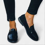 Black loafers with chunky sole and textured toe detail