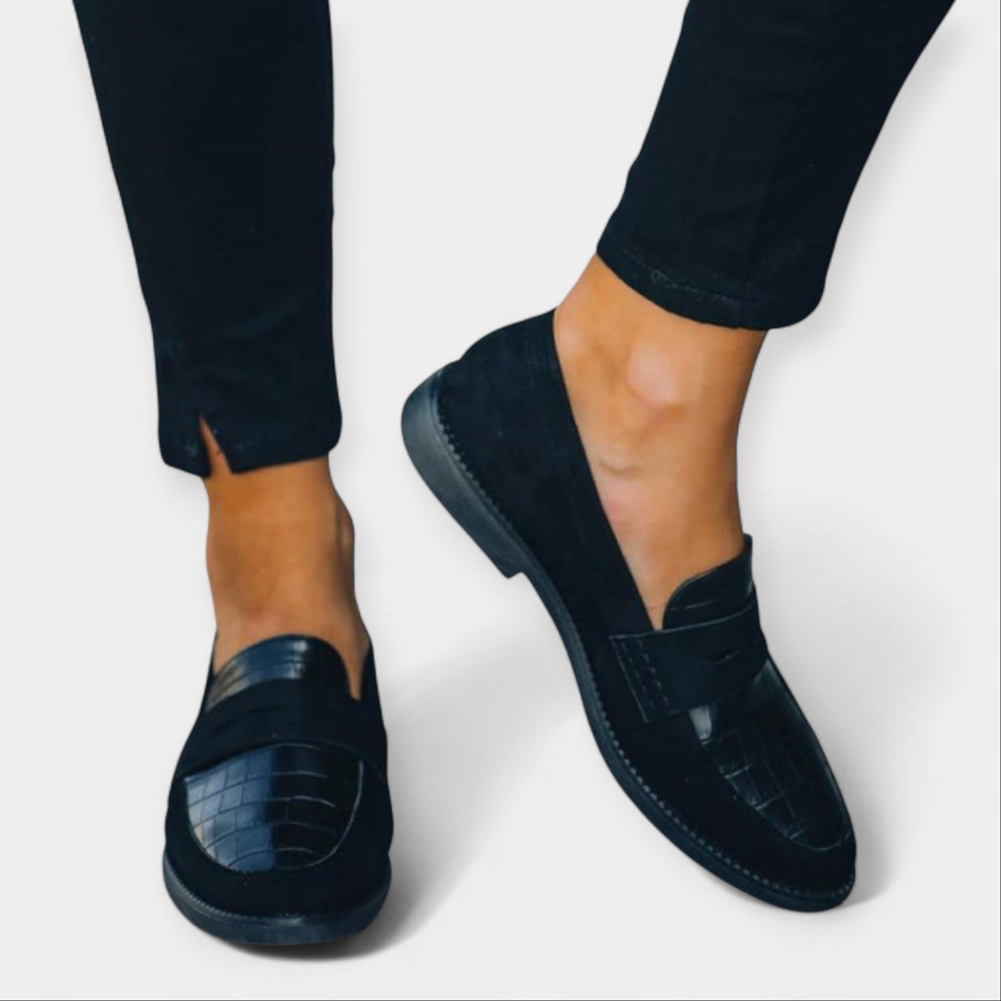 Black loafers with chunky sole and textured toe detail