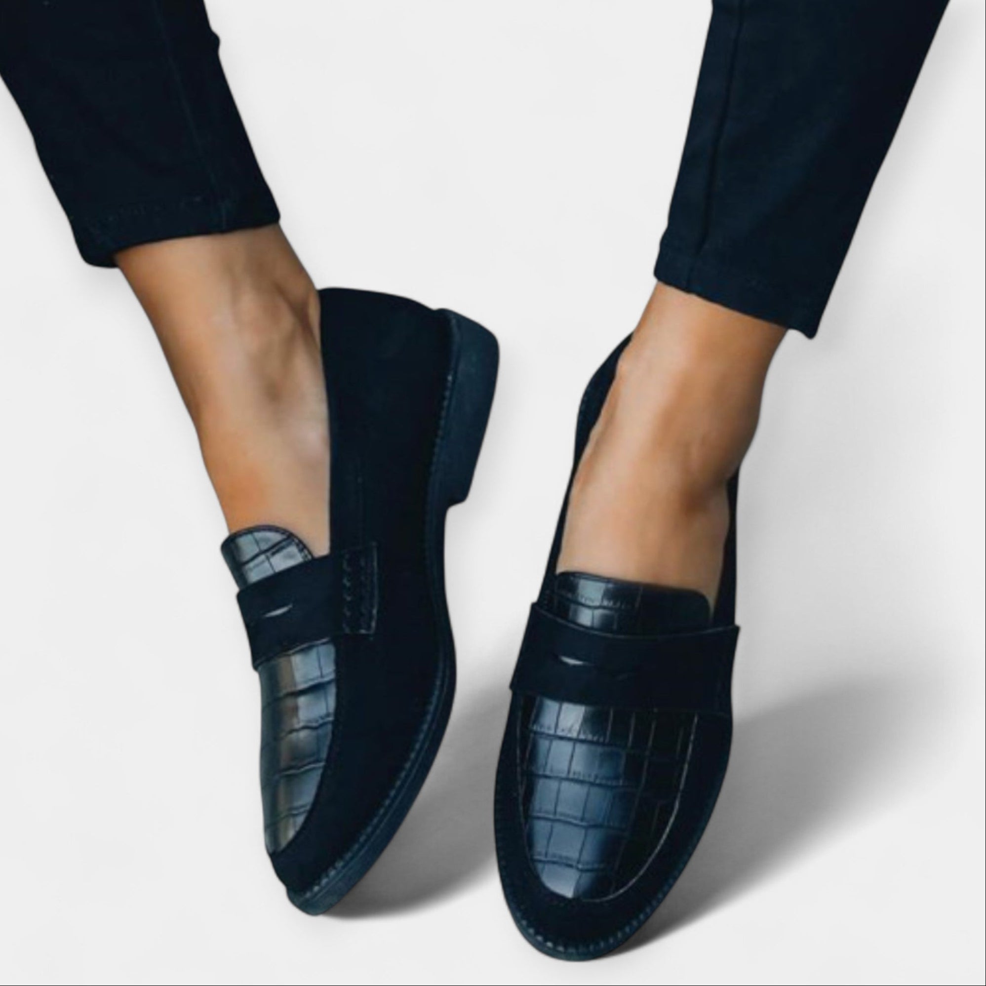 Black loafers with croc-embossed upper and thick comfort sole