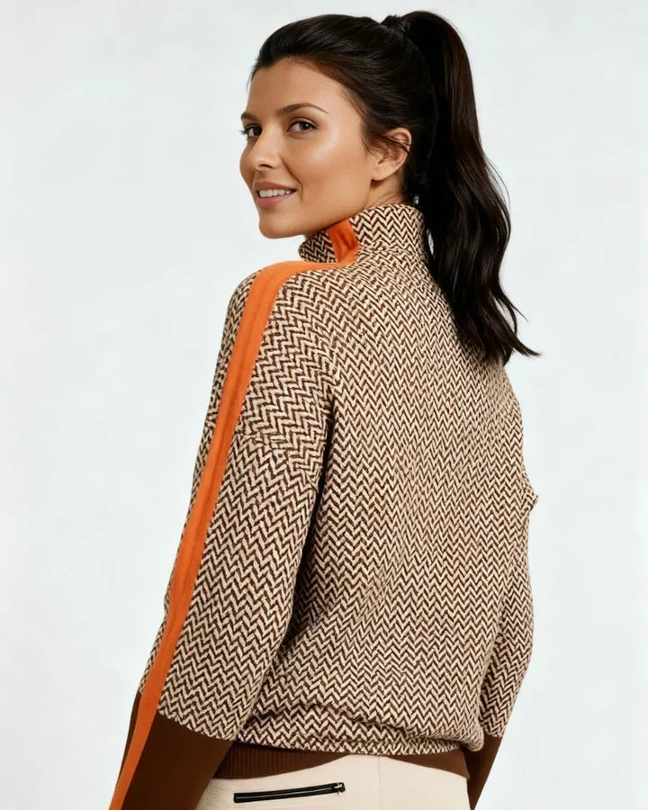 High-neck chevron sweater with orange contrast trim along sleeves, ribbed hem and cuffs