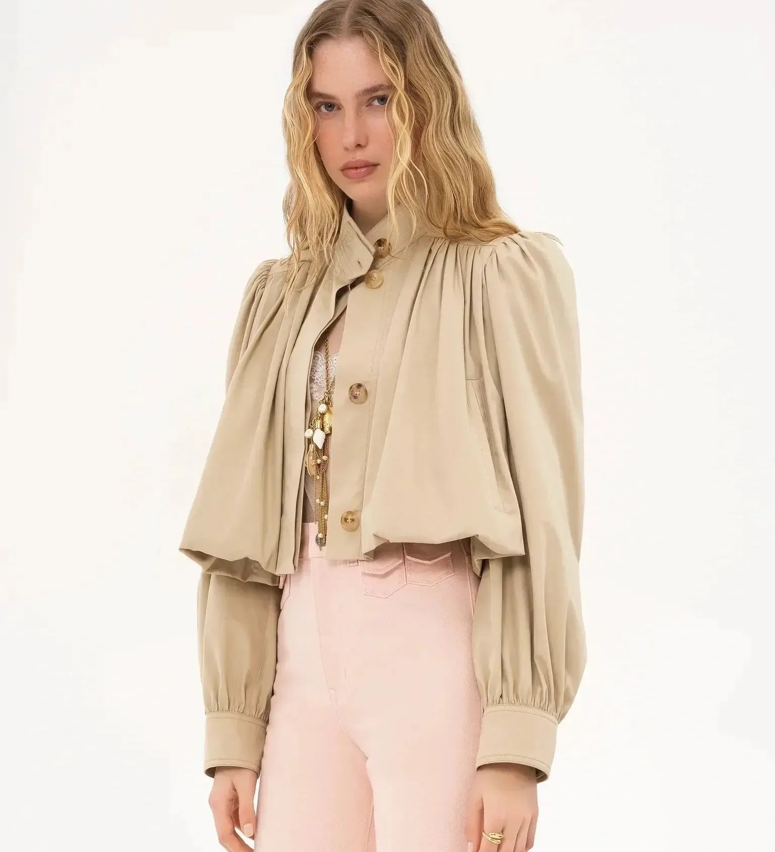 Cream cropped blouse jacket with gold buttons, high neck, and puffed sleeves