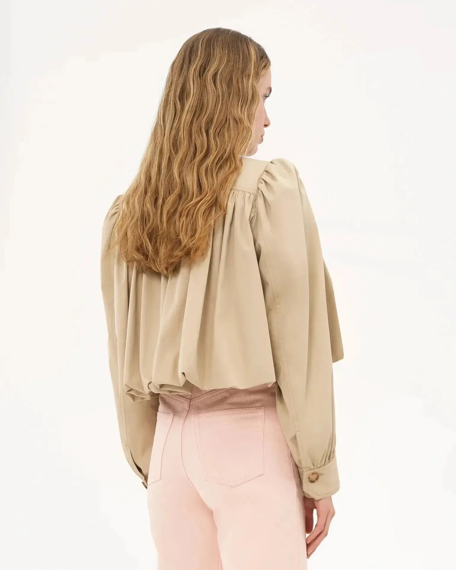 Cream cropped jacket with pleated back yoke and wide voluminous sleeves, button front