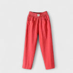 Linen trousers in red with elastic waistband and side patch pockets