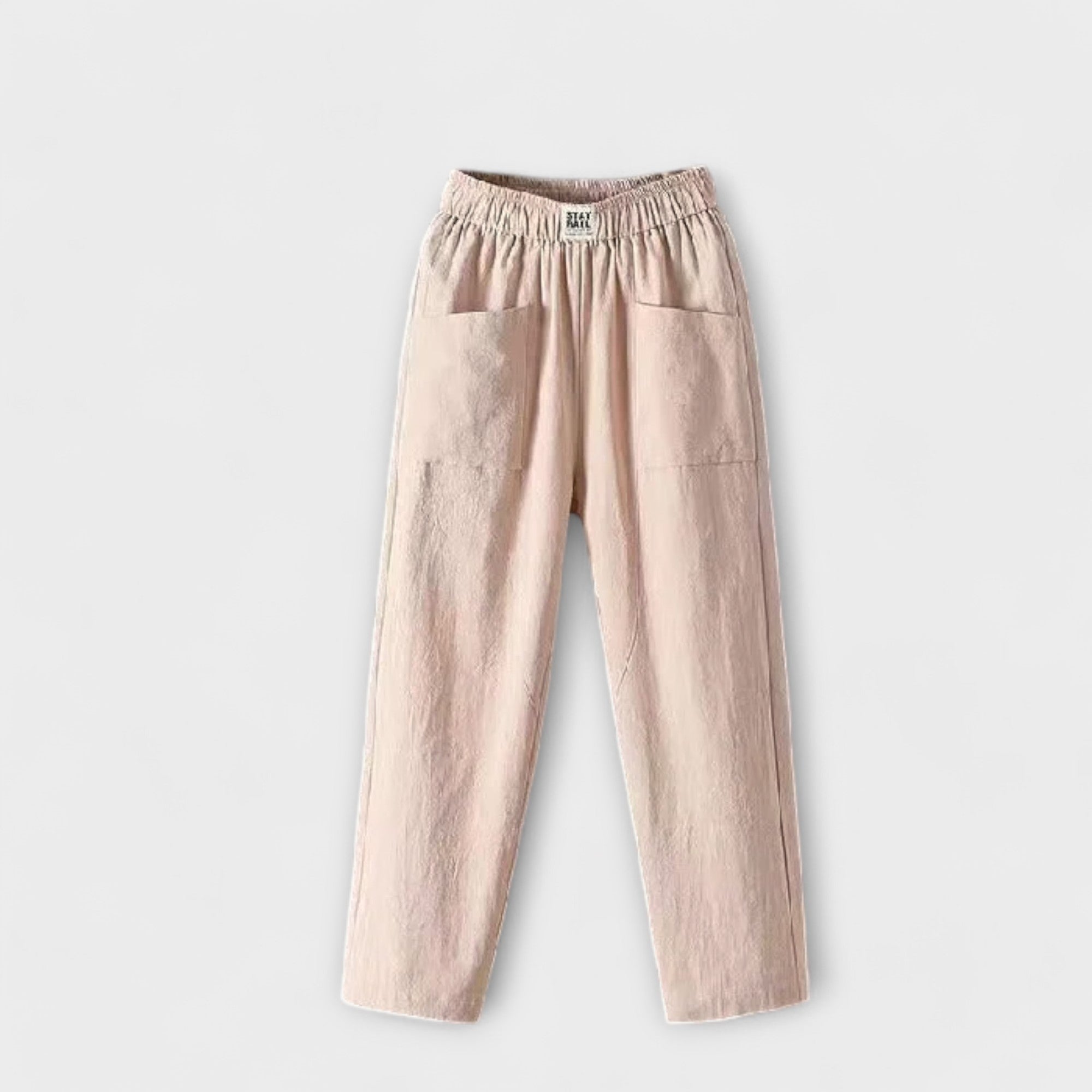 Linen trousers in beige with elastic waistband and side patch pockets