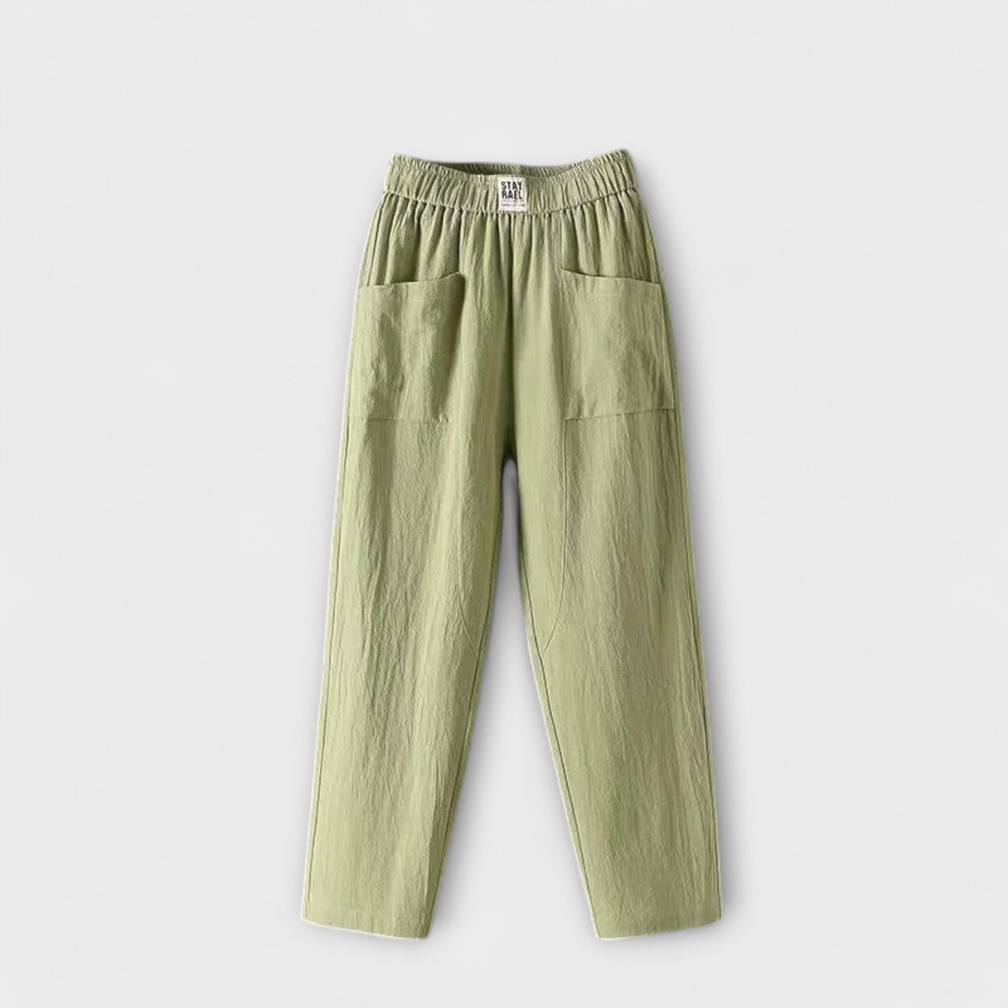 Linen trousers in light green with elastic waistband and side patch pockets