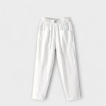 Linen trousers in white with elastic waistband and side patch pockets