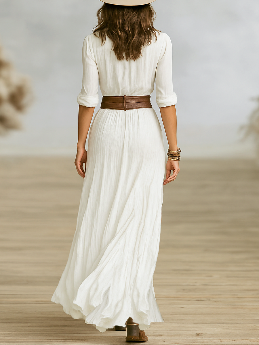 White long linen dress back view with reverse collar, gathered waist and pleated skirt.