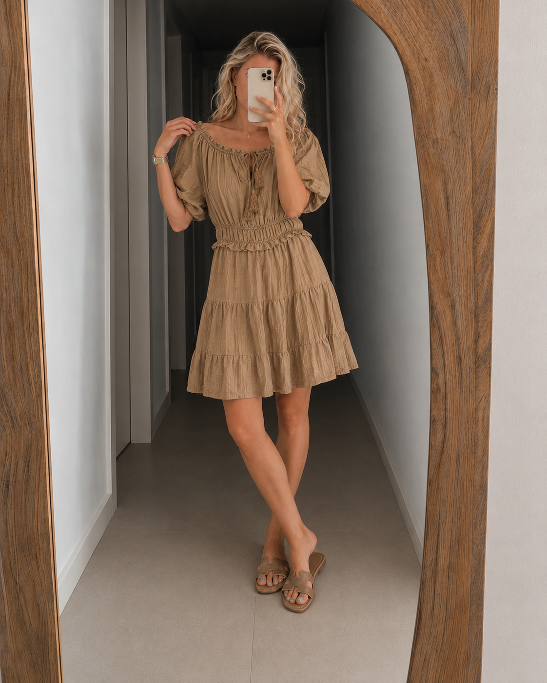 Off-shoulder tiered mini dress in taupe beige with puff sleeves and smocked waist