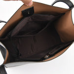 Tan shoulder bag interior with zip opening and fabric lining